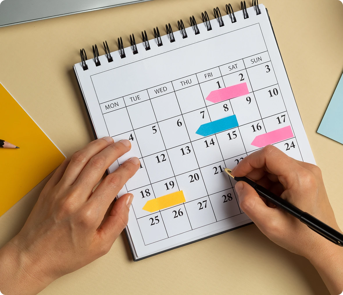 Colorful notes on a monthly planner