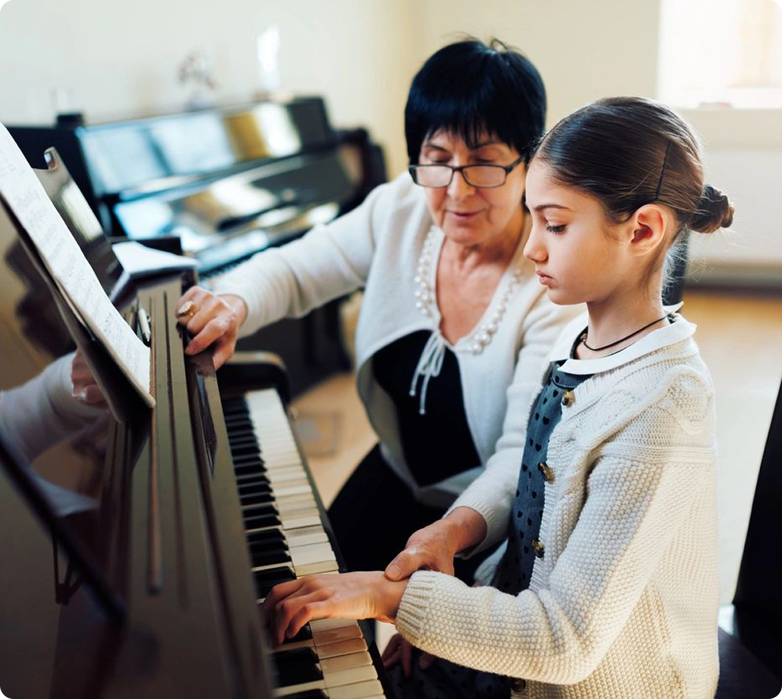 Young girl learning piano skills