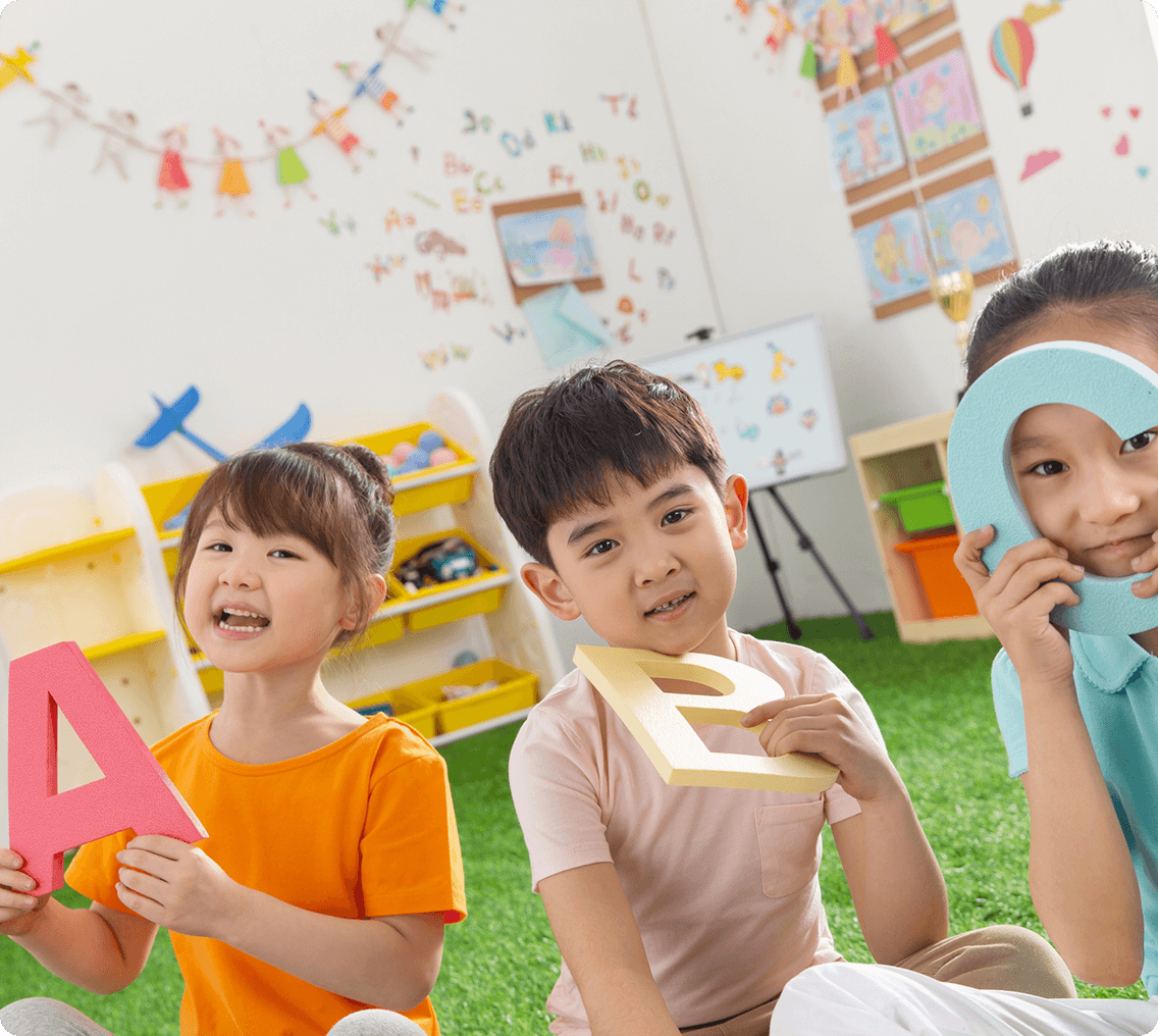 Kids playing with alphabet letters indoors