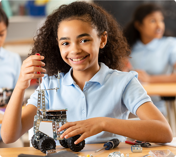 Young girl engaged in robotics project