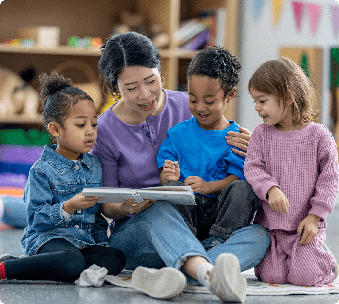 Teacher reading to young children