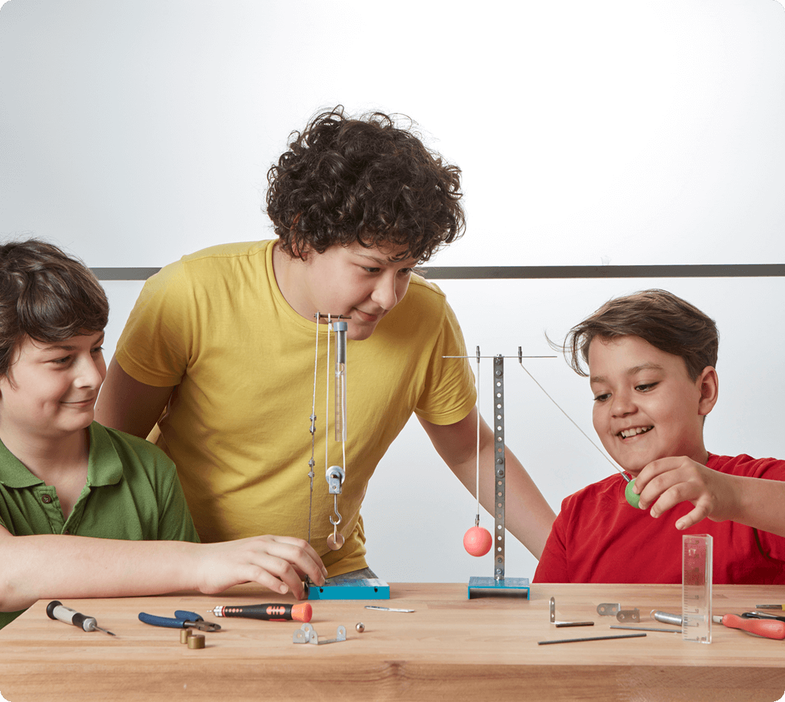 Kids experimenting with physics tools