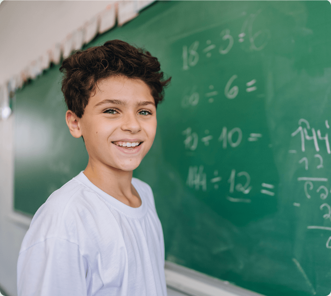 Student in front of chalkboard