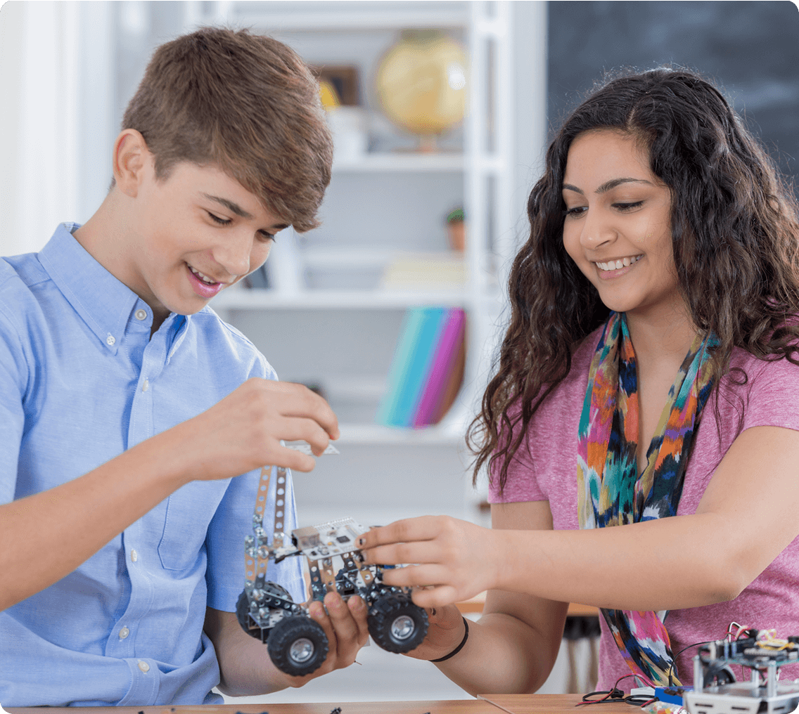 Teenagers working on robotics project