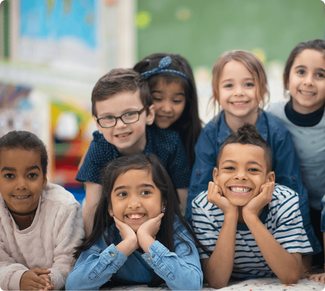 Group of happy kids in classroom
