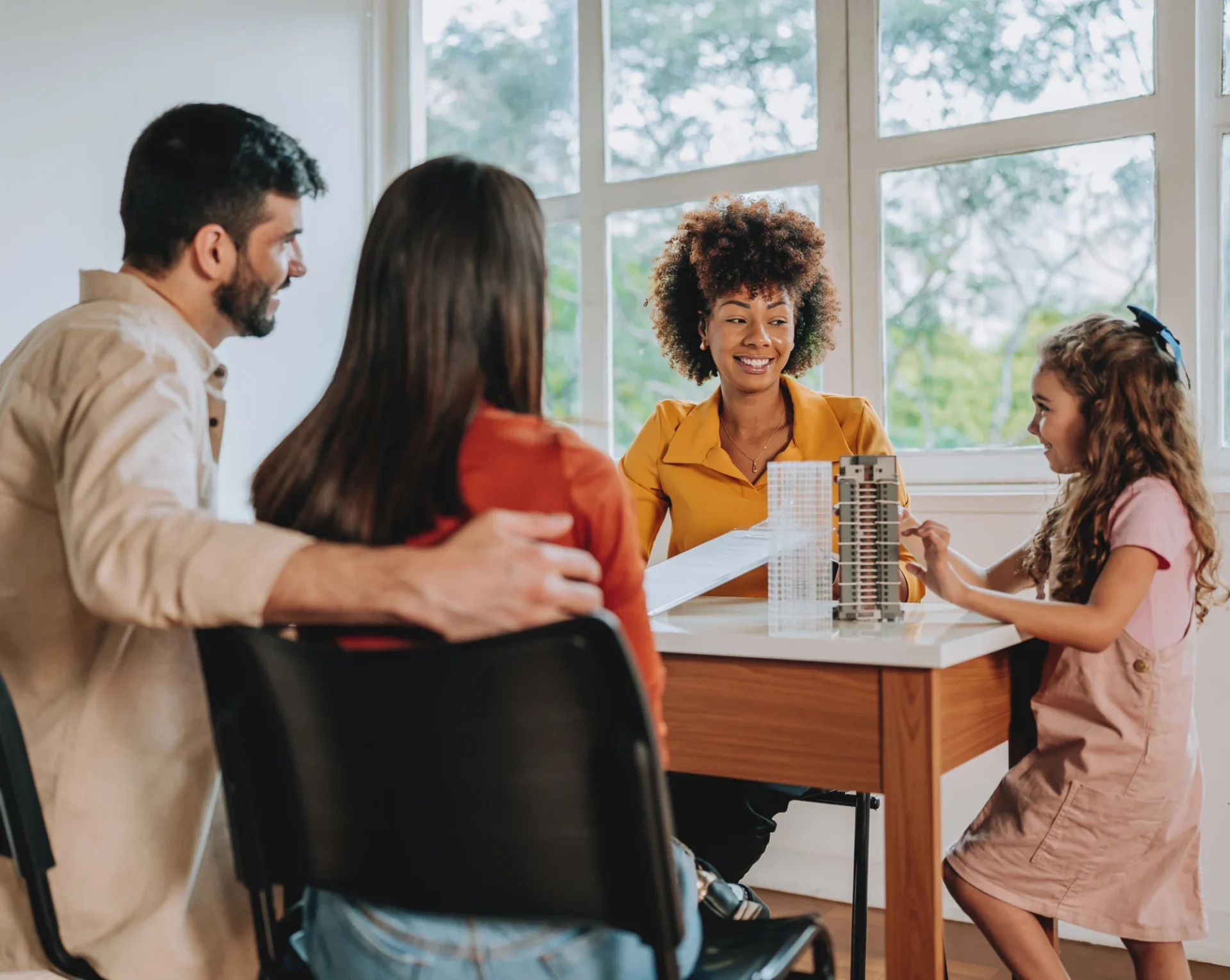 Family discussing with consultant at table