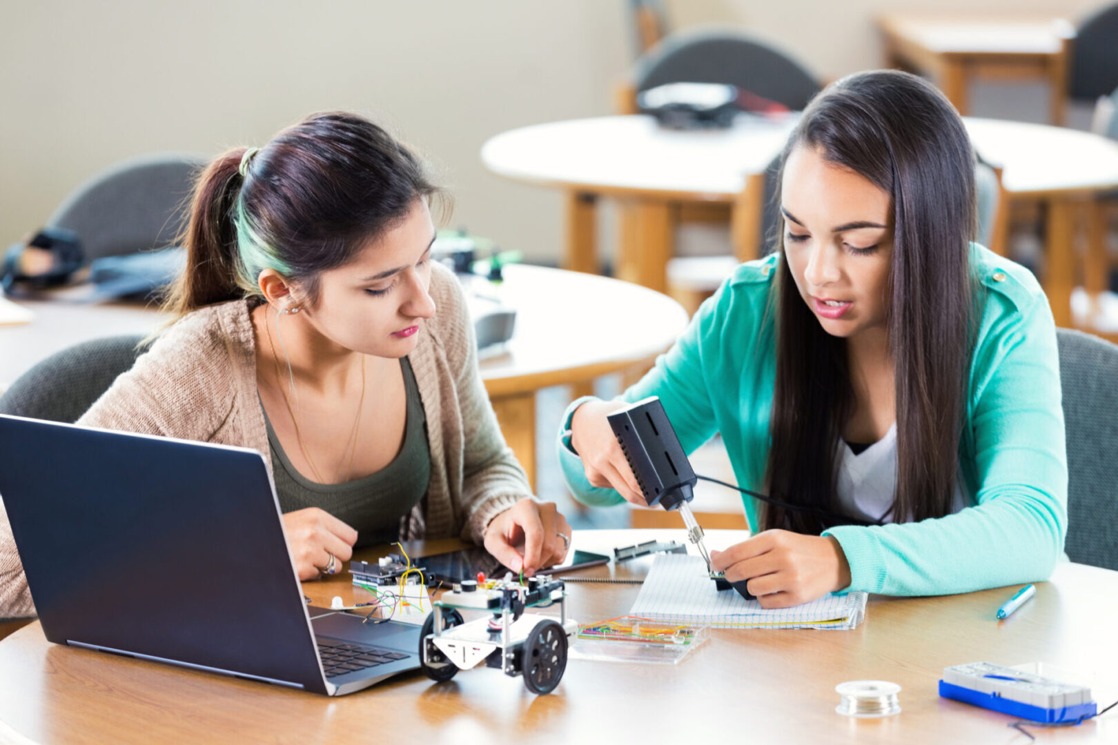Girls working on robotics project together
