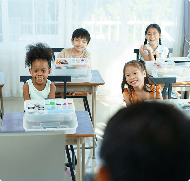 Kids with art supplies in classroom