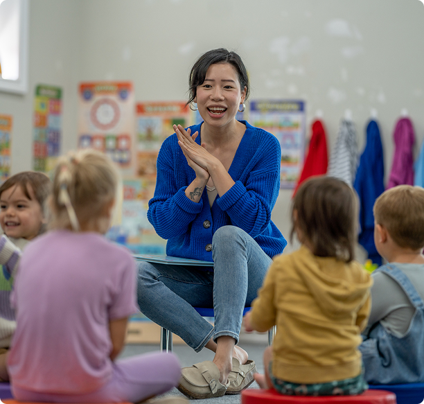 Educator leading group activity with kids