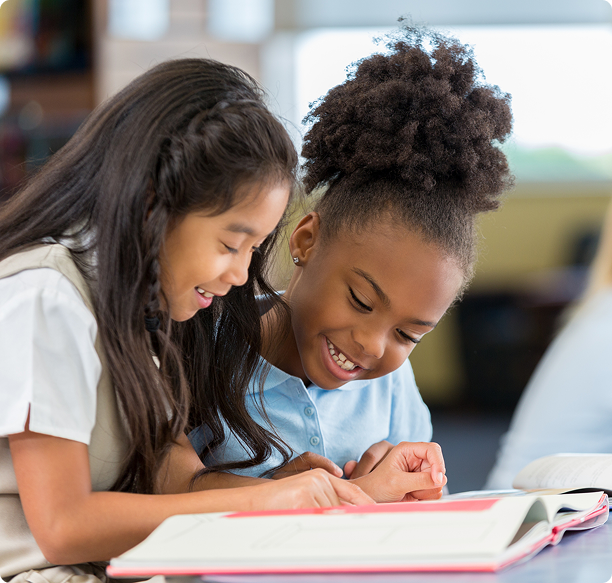 Two girls enjoying a storybook