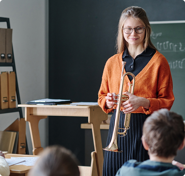 Music lesson with trumpet in school