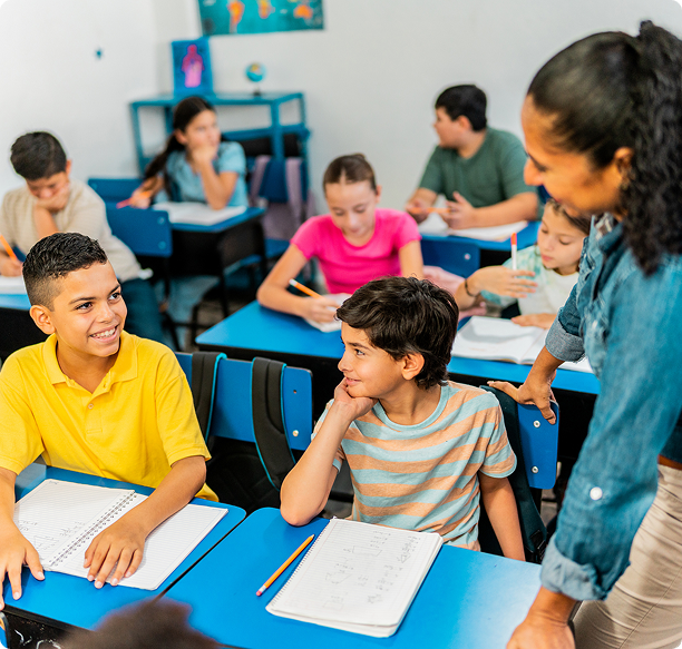 Students and teacher interacting in classroom