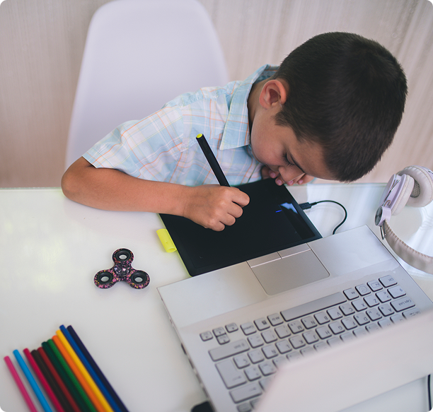 Young artist concentrating on tablet drawing