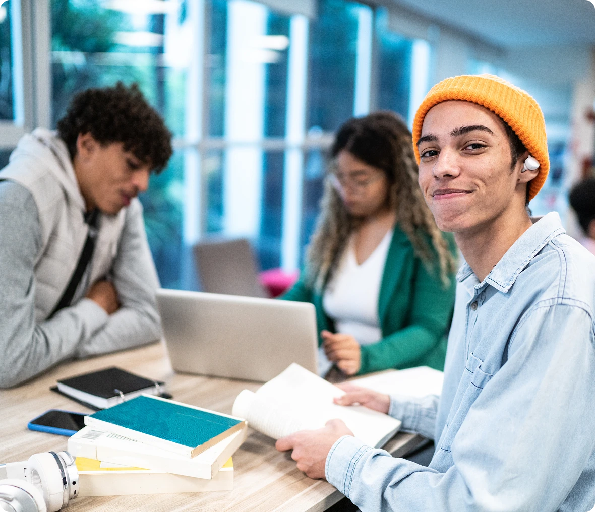 Group of students collaborating with books