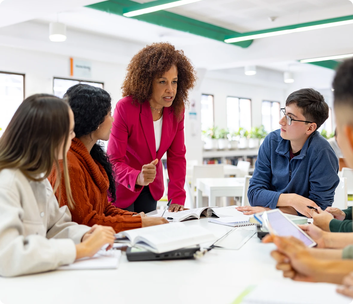Teacher leading group discussion in classroom