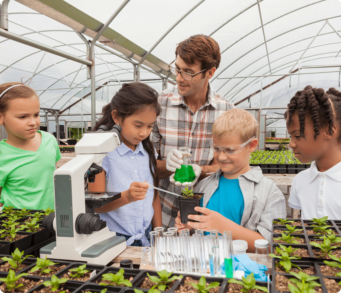 Children learning in a greenhouse lab