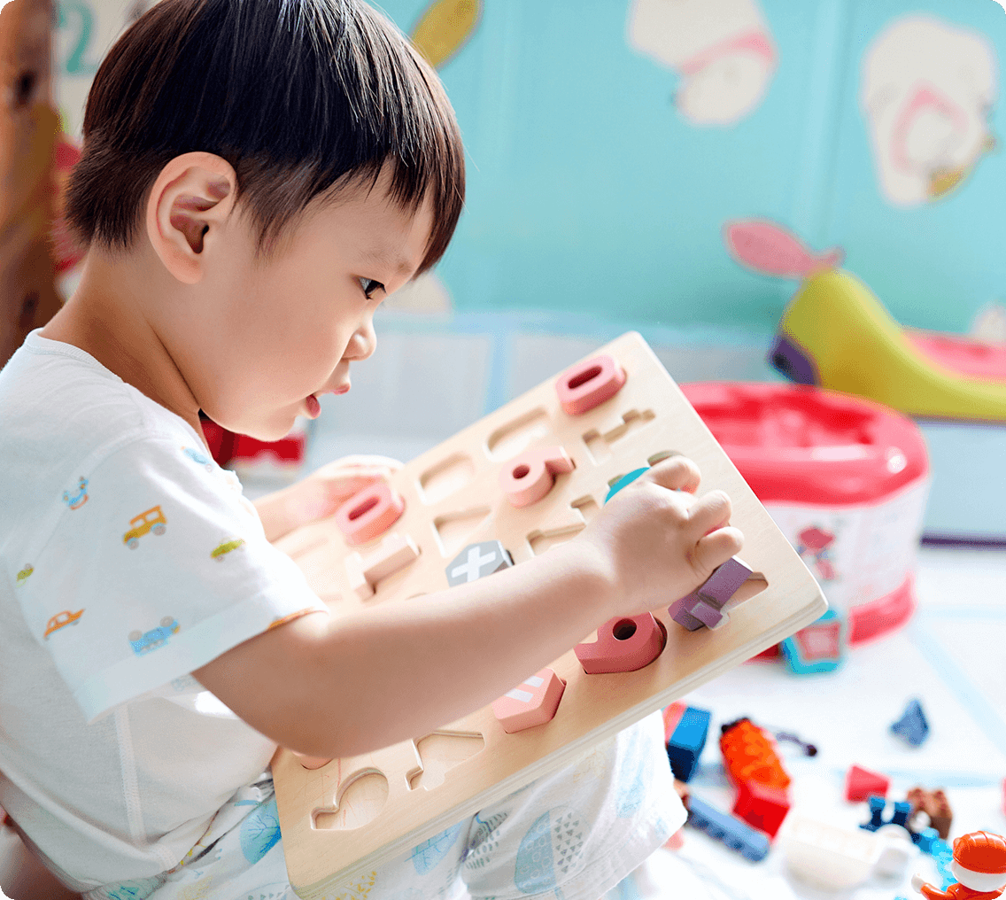 Toddler engaging in educational activity